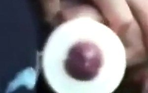 Buddies using a cock sleeve together with nice cumshots