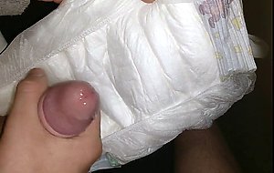 Twink cumming his wet diaper