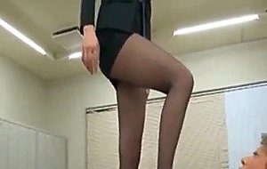 Asian hottie in stockings gives foot job