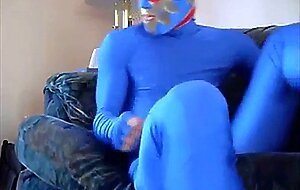 dude in mask a blue zentia suit strokes his big cock