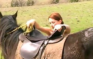 Busty redhead abby rides a horse nude