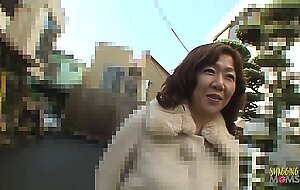 Busty Asian brunette lifts her legs up so the cum drips down her asshole
