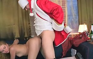 Gorgeous young blonde gets to fuck Santa Claus
