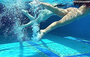 Sexy babes with big tits swim underwater in the pool