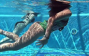 Sexy babes with big tits swim underwater in the pool