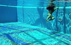 Sexy babes with big tits swim underwater in the pool
