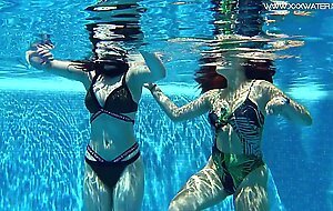 Sexy babes with big tits swim underwater in the pool