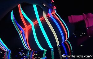 Colorful blacklight teasing with Samantha Saint