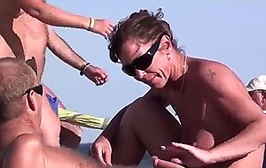 French nudist couple doing a hand- and bj in public on the beach