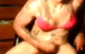 Oiled crossdresser jerks off