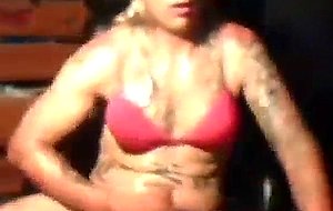 Oiled crossdresser jerks off
