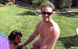 Jennifer and her friend suck one cock outdoor