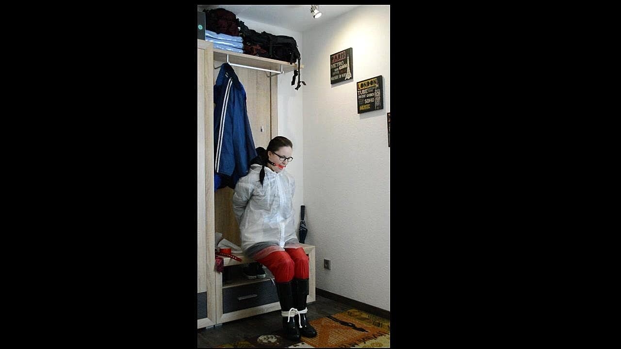 Solo Woman Lady Nadja Layers Herself In Rainwear During Self Bondage Action Boots, Clothed, Fetish, Glasses, Latex