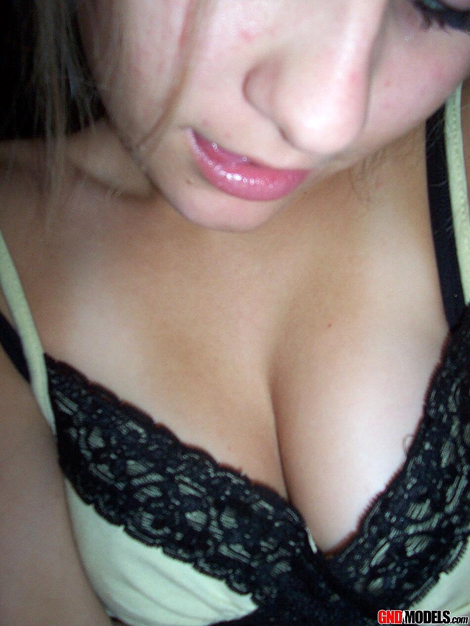 Blonde amateur Kylie takes off her brassiere in a tempting fashion