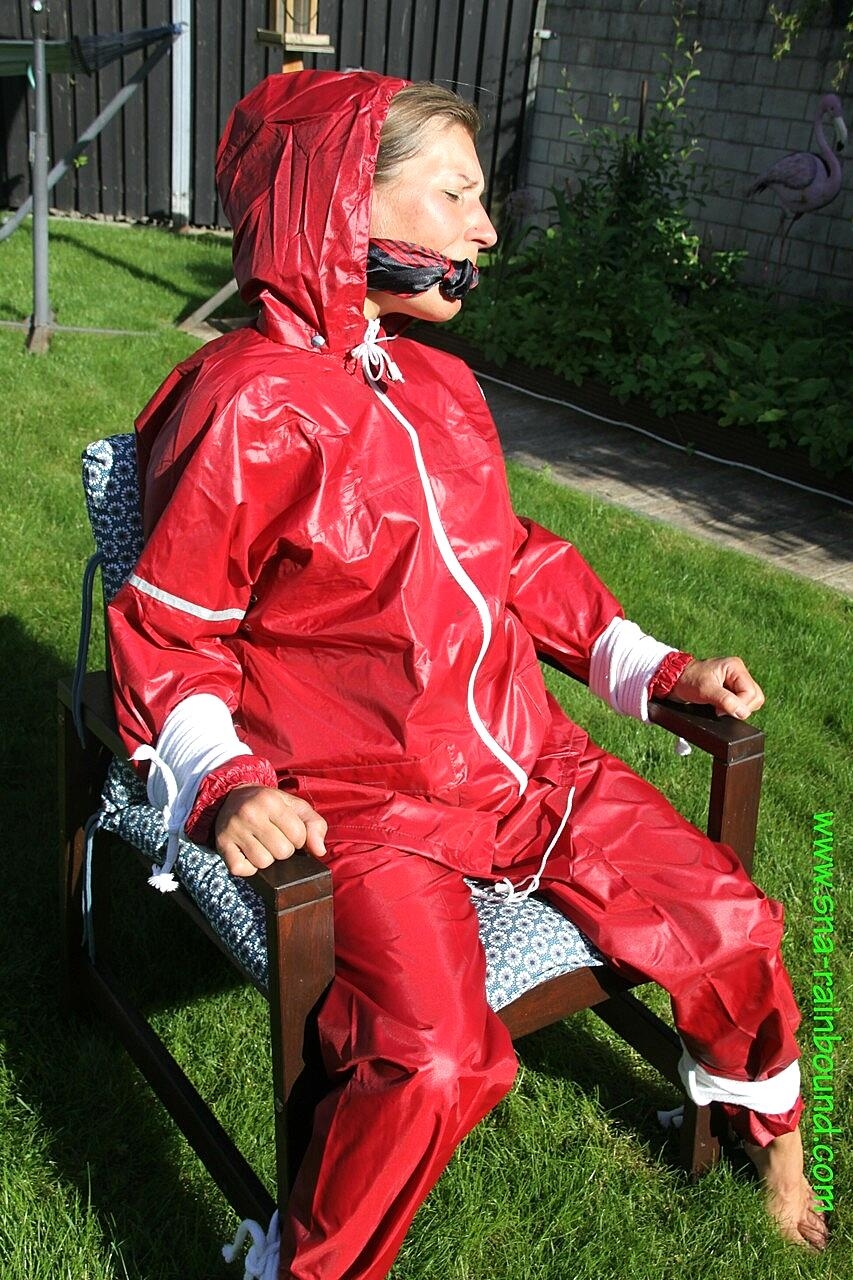 Amateur chick is subjected to breath play while affixed to a chair in a yard