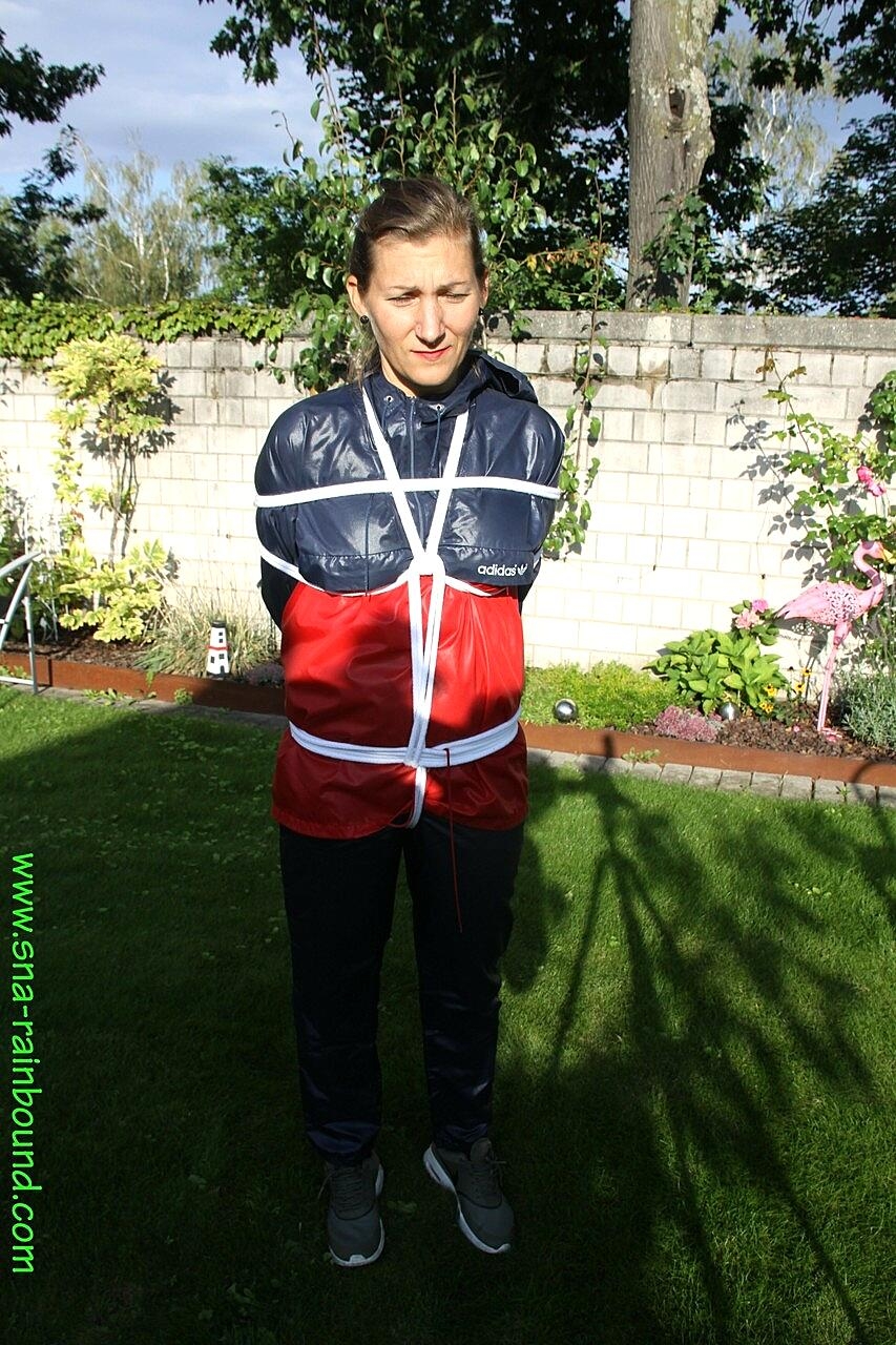 Submissive Woman Sandra Is Tied Up While Wearing A Raincoat In A Sunny Yard Amateur, Bdsm, Blindfold, Clothed, Outdoor