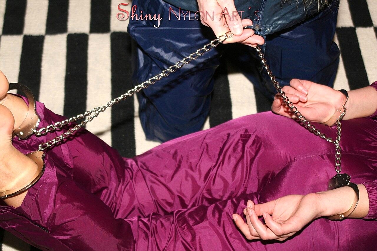 White girl restrains her lesbian lover with cuffs in nylon clothing