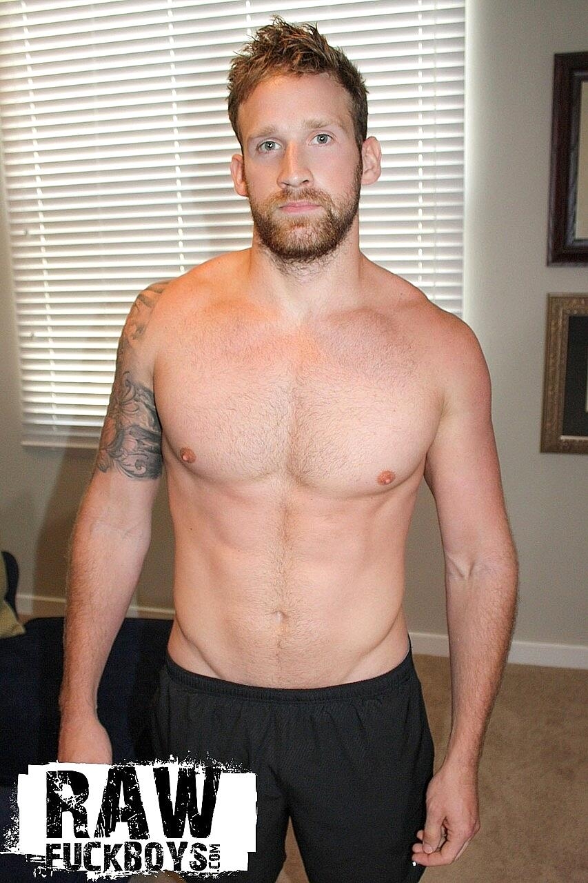 Gay bodybuilder Logan Carter strips on his bed and flaunt his cock and muscles