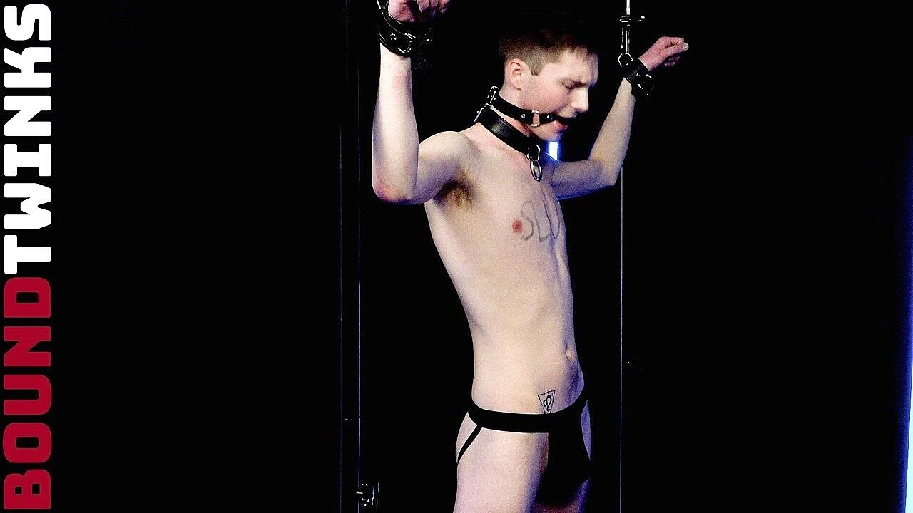 Submissive twink Liam Evans gets a handjob in a BDSM session with Tyler Tanner