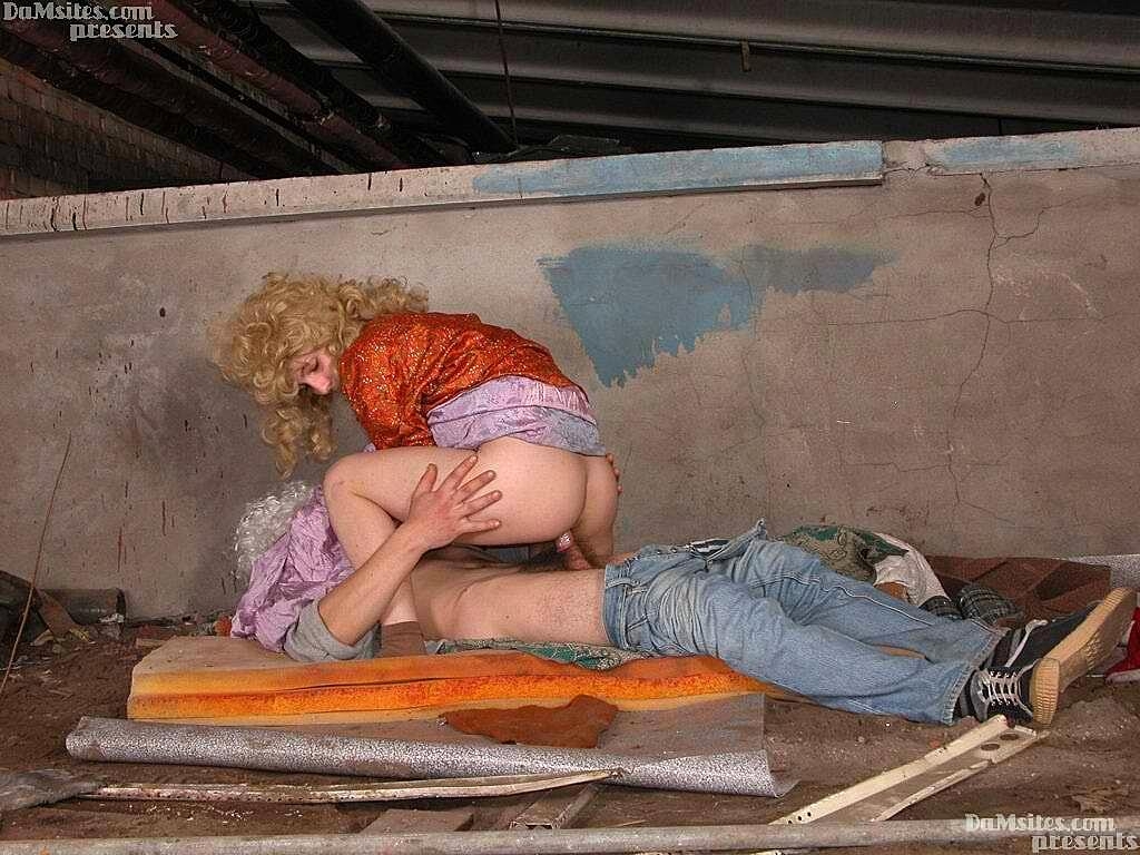 Homeless couple have sex in a sheltered location while wearing wigs