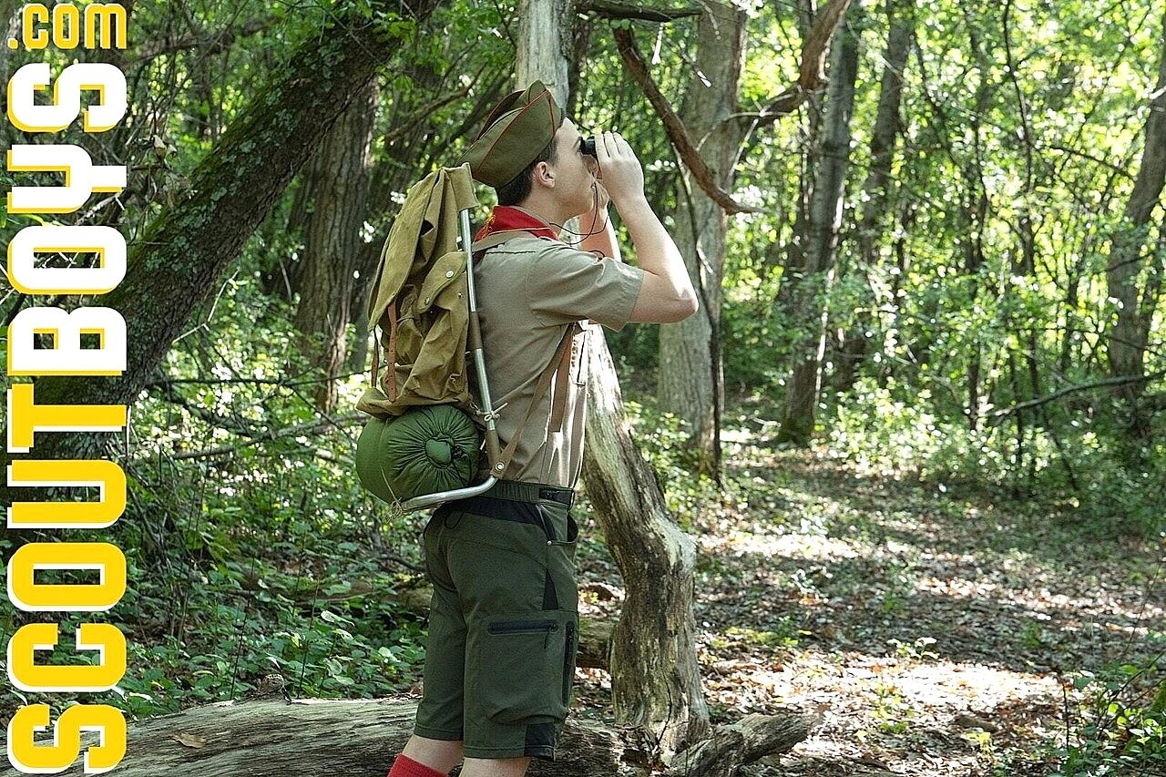 Scoutmaster Wolf enjoys doggystyle anal sex with a twink in the woods